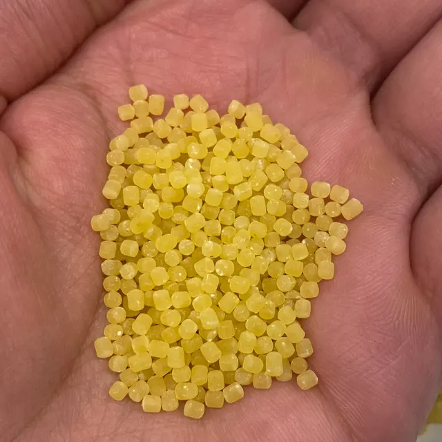 A close up shot of Acini di pepe in a hand