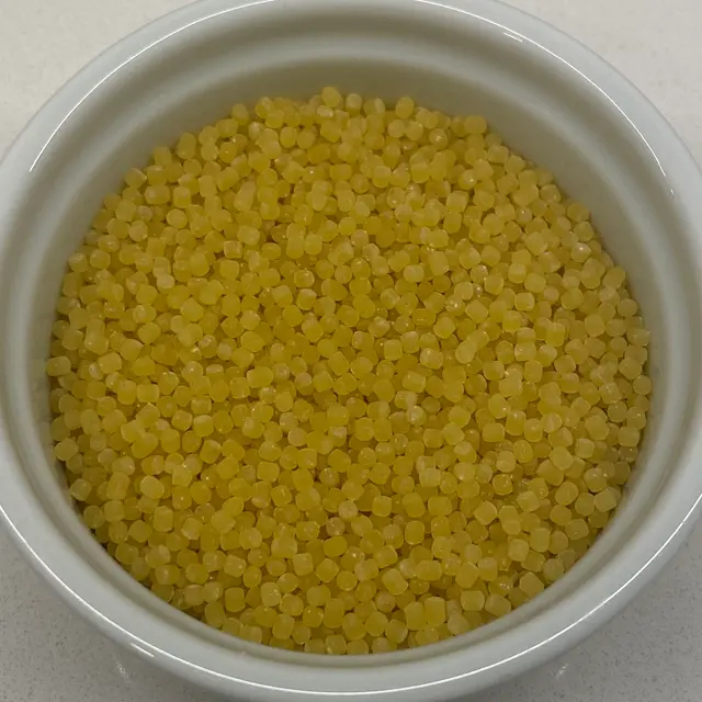 A close up shot of Acini di pepe in a round white ramekin