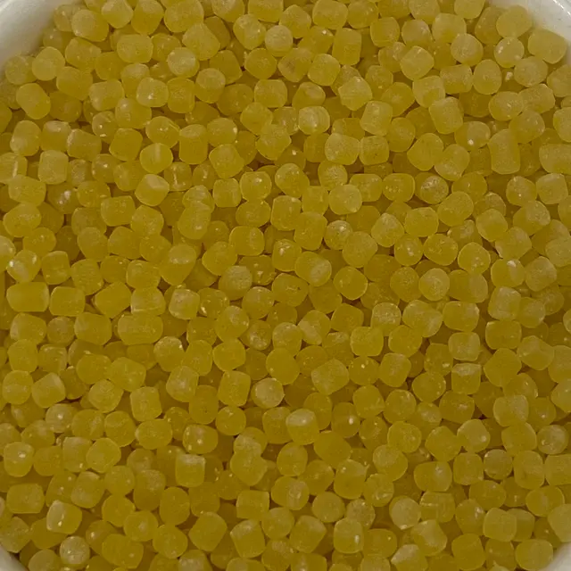 A close up shot of Acini di pepe in a small round white glass bowl