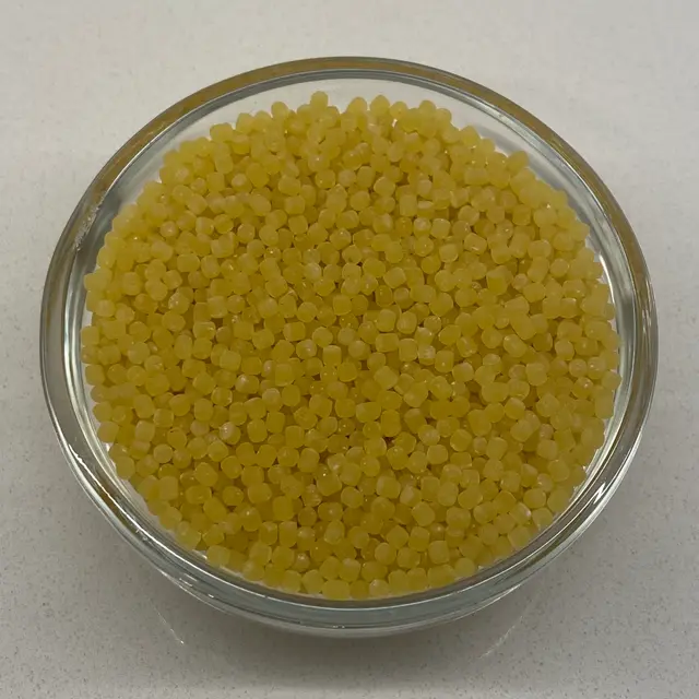 A close up shot of Acini di pepe in a small round white glass bowl