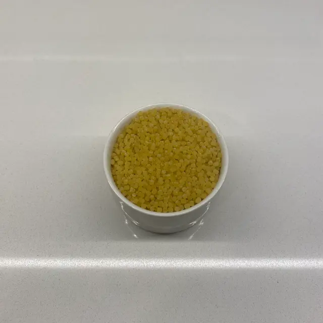 Acini di pepe in a small white bowl