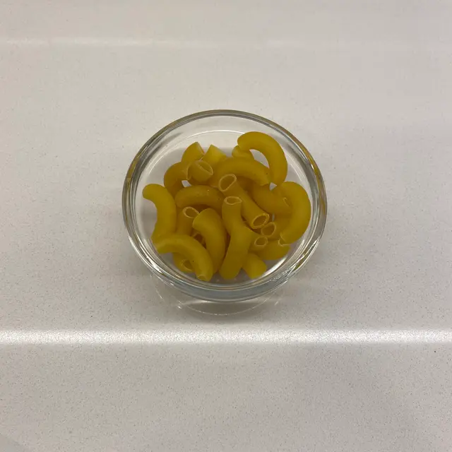 Large Elbow Macaroni in a small round white glass bowl