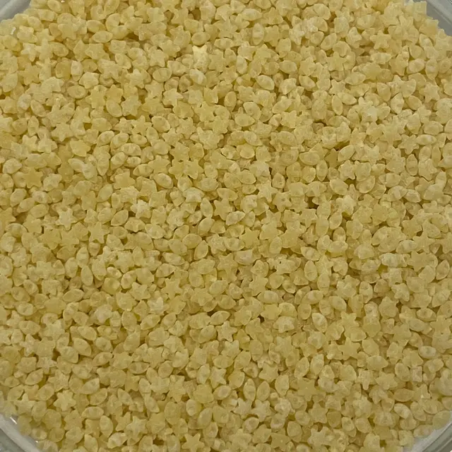A close up shot of Pastina in a small round white glass bowl
