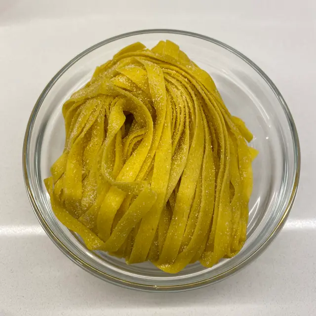 Tagliatelle in a clear round glass bowl