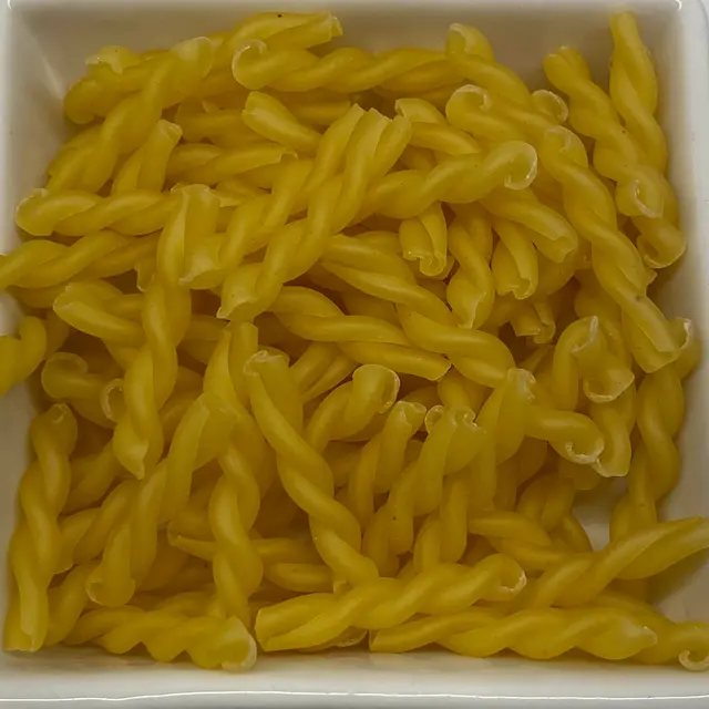 A close up shot of Treccine in a square white glass bowl