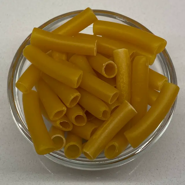 A close up shot of Ziti in a small round white glass bowl