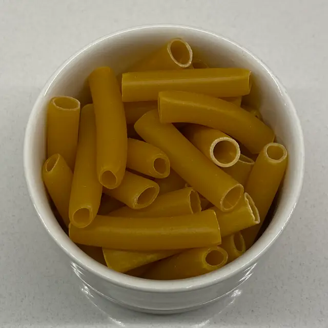 A close up shot of Ziti in a small white bowl
